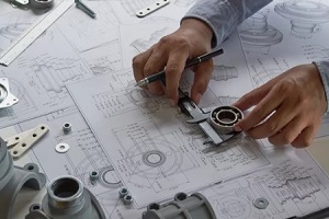 man making new machine design