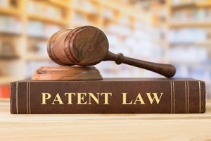 court gavel on patent law book