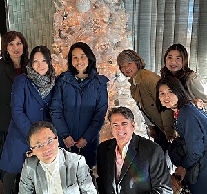 holiday lunch metrolex team in front of christmas tree