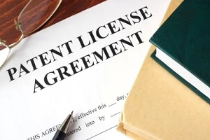 patent license agreement with diary and pen